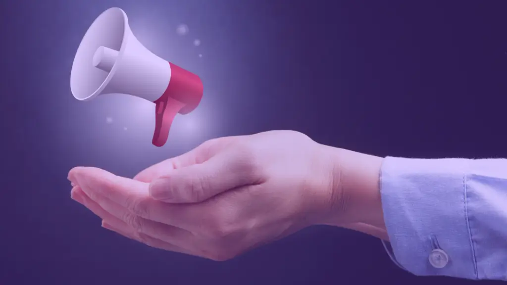 Outstretched hand holding a floating megaphone, symbolizing communication and message amplification